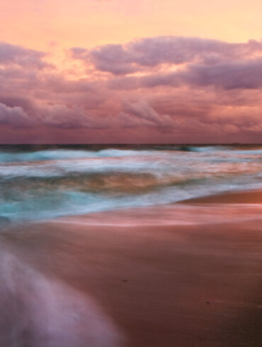 A long exposure photo taken at sunset on the beach in South Florida
